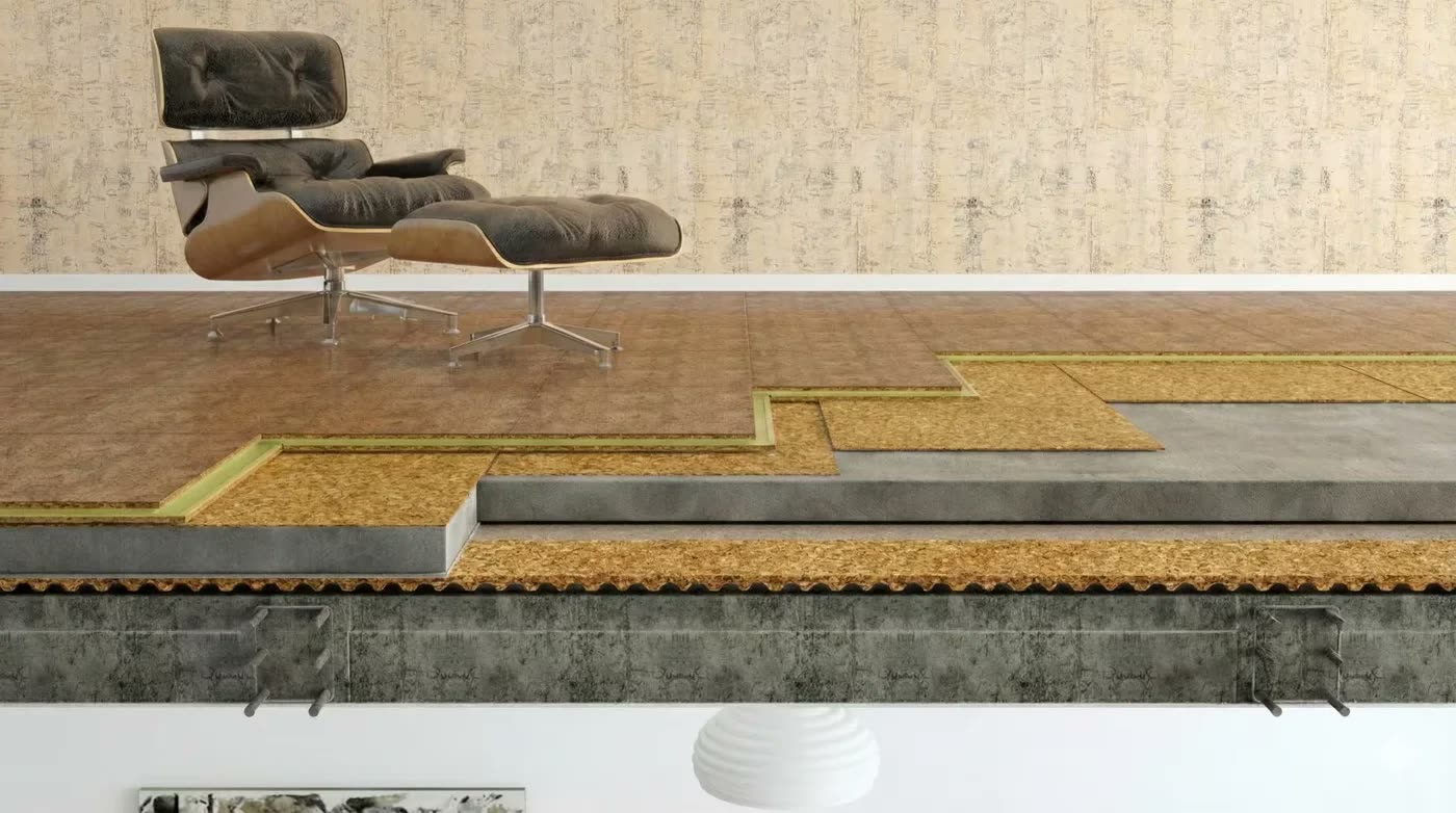 Zemin ses yalıtımı katmanlarını (beton, keçe/dolgu, parke) gösteren 3D kesit illüstrasyonu, üzerinde koltuk